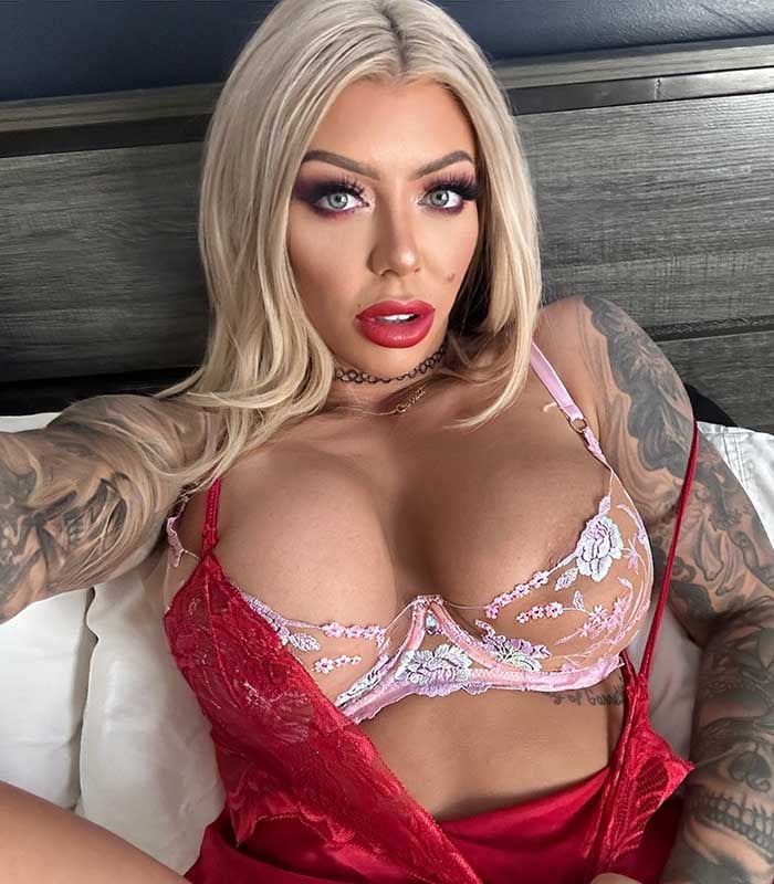 Karma RX, biggest tits pornstar, wears sexy lingerie and shows her massive tits.