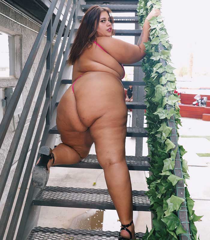 Top BBW pornstar Breana Khalo showing off her big ass on stairs